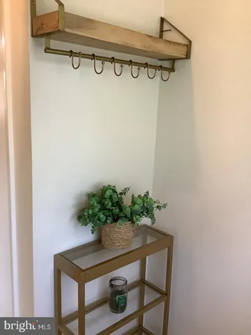 a table with a vase and flowers on it