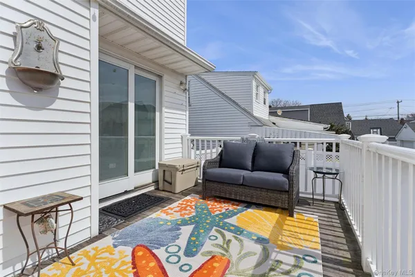 a view of a balcony with furniture