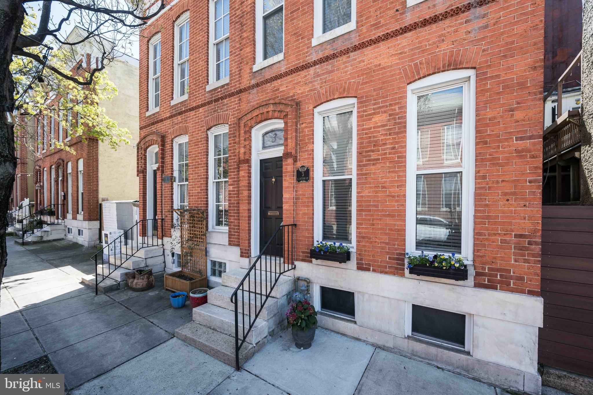 3 East Ostend Street Baltimore, MD 21230 - Photo 1 of 25 a view of a brick building with a bench in front of building