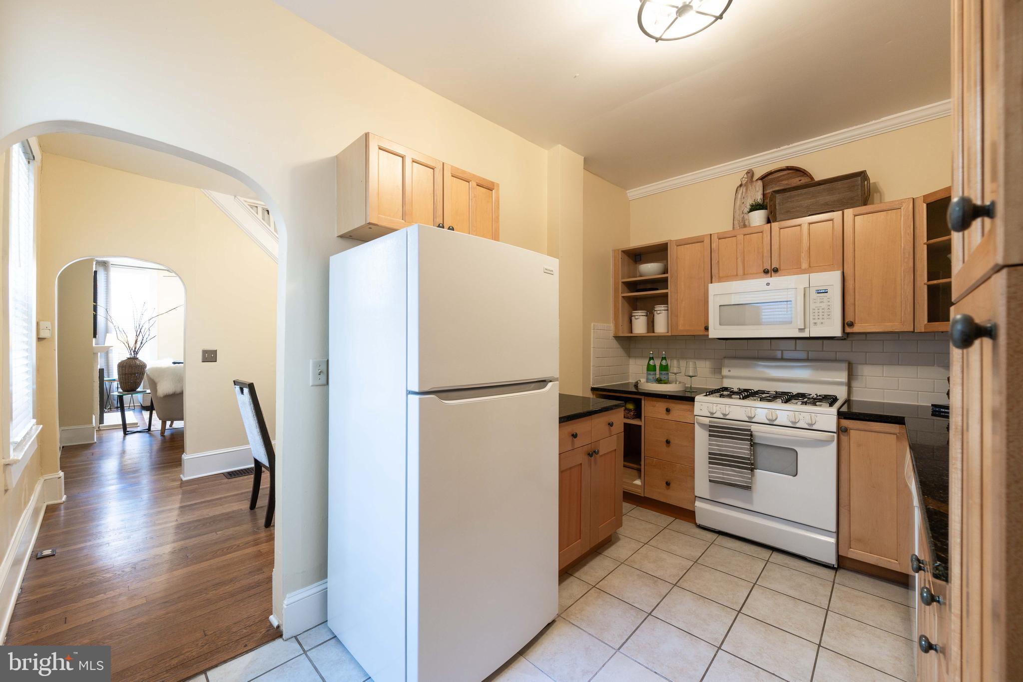 3 East Ostend Street Baltimore, MD 21230 - Photo 13 of 25 a kitchen with a refrigerator a stove and a sink