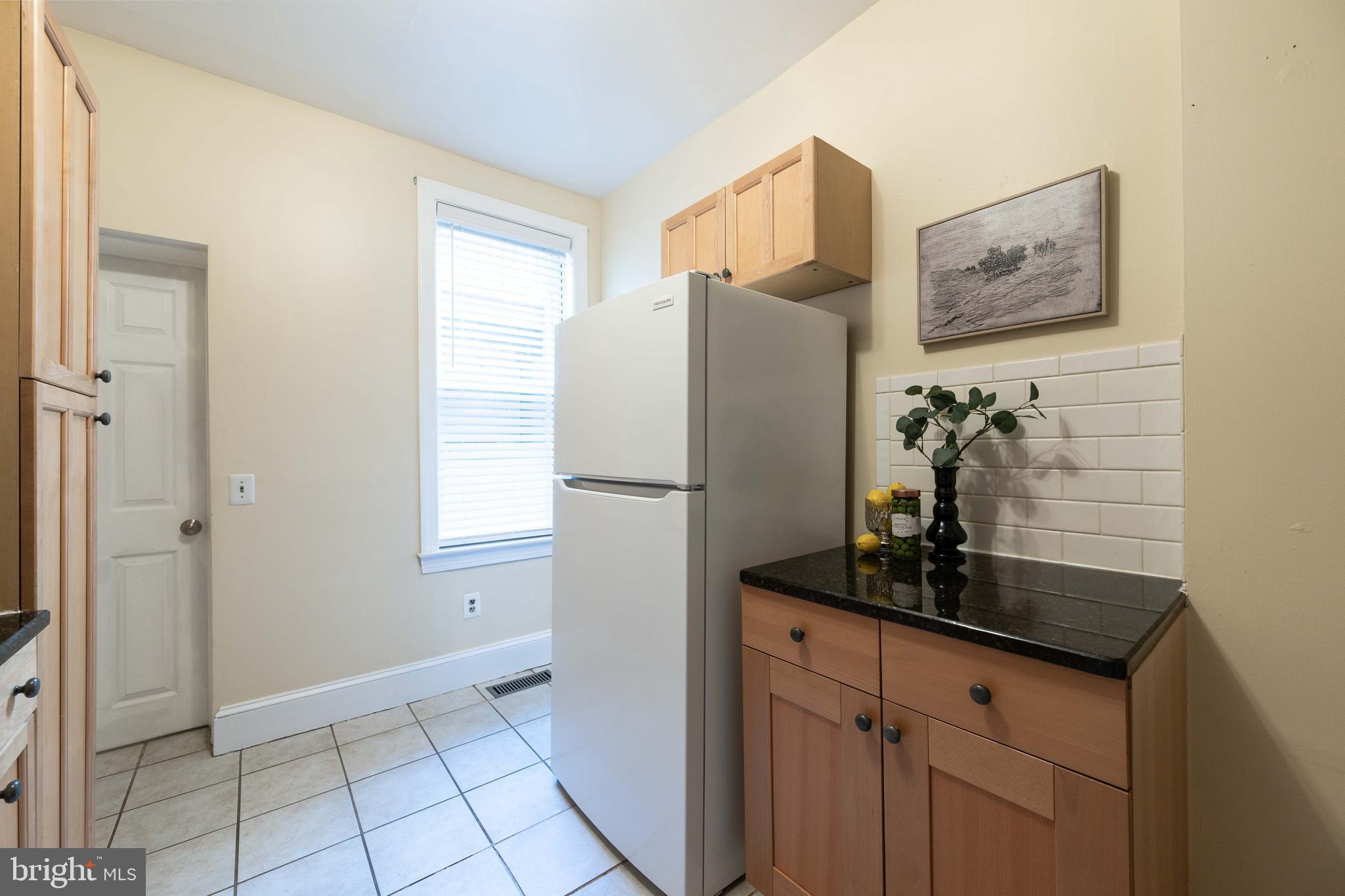 3 East Ostend Street Baltimore, MD 21230 - Photo 16 of 25 a kitchen with a refrigerator and a sink