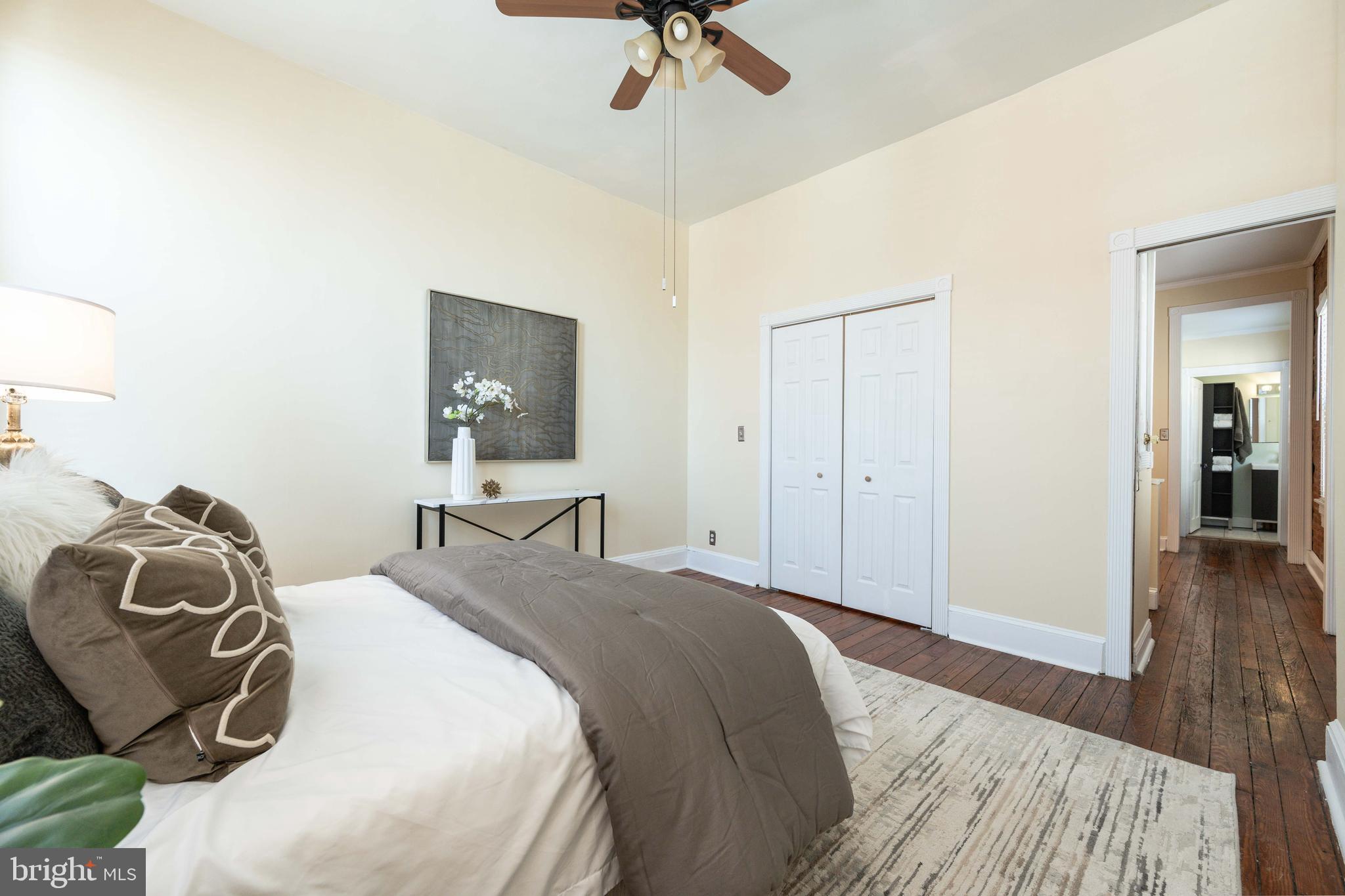 3 East Ostend Street Baltimore, MD 21230 - Photo 20 of 25 a bedroom with a bed and wooden floor