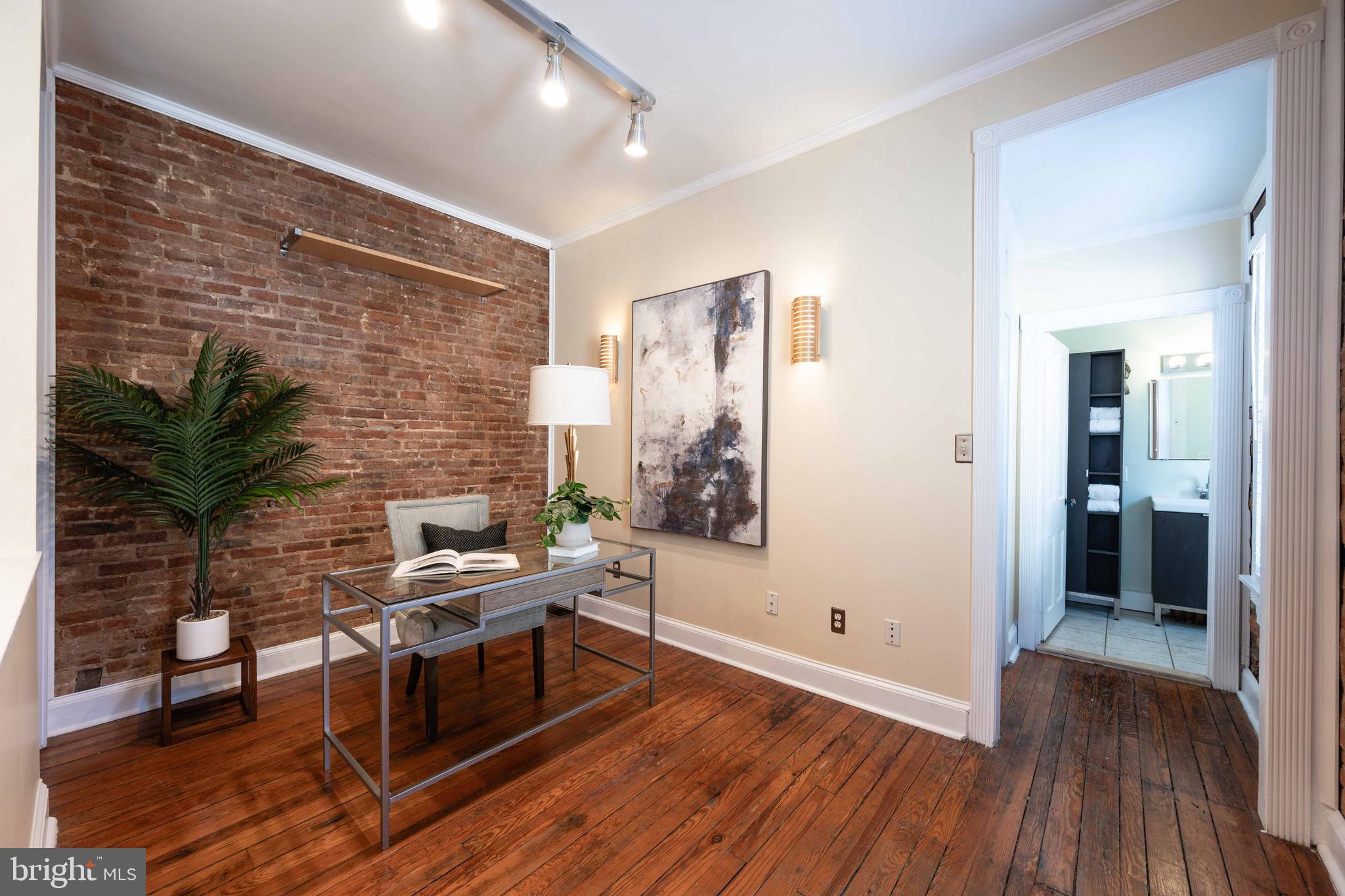 3 East Ostend Street Baltimore, MD 21230 - Photo 21 of 25 a workspace with furniture window and wooden floor