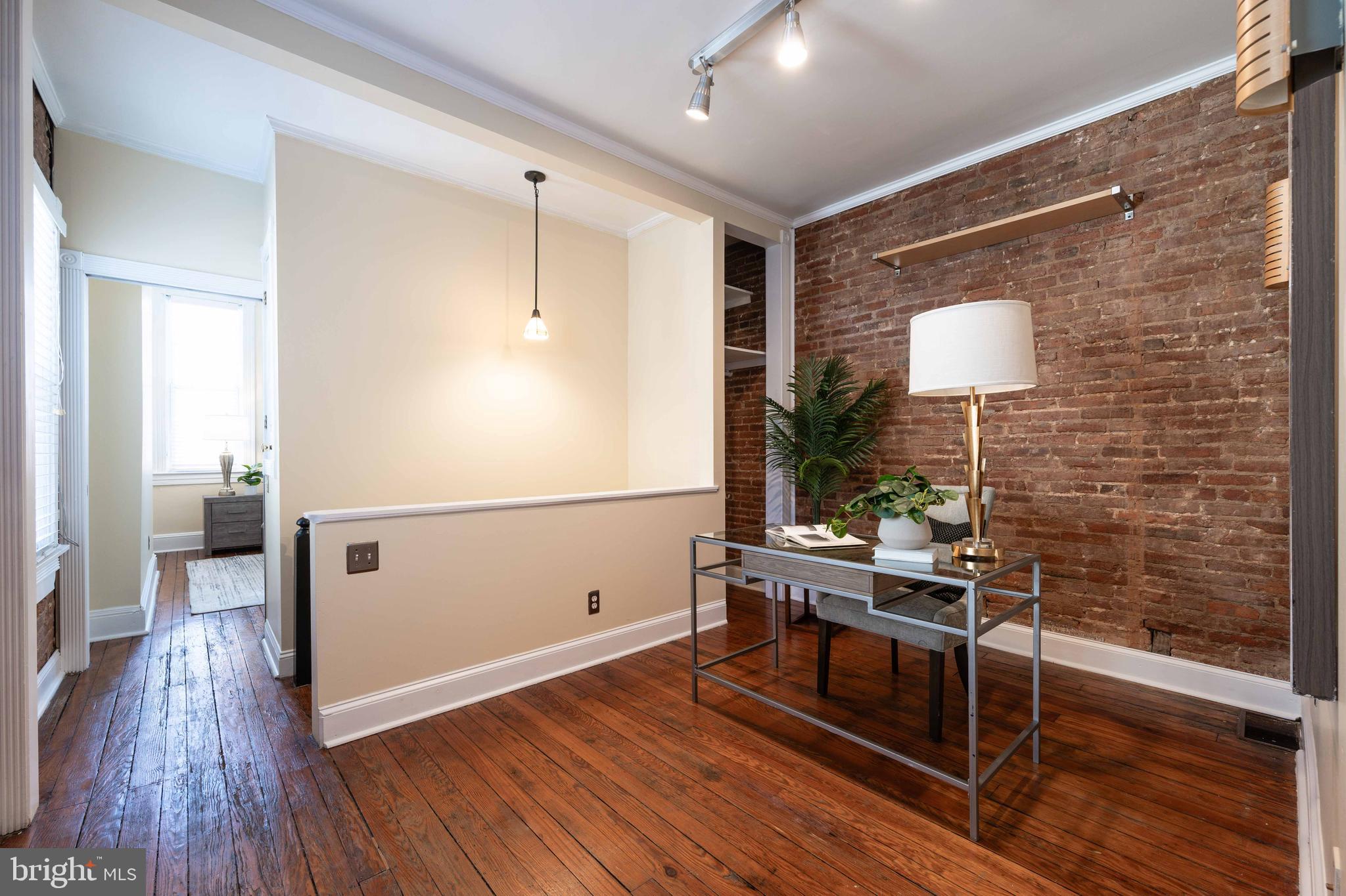 3 East Ostend Street Baltimore, MD 21230 - Photo 22 of 25 a kitchen with a wooden floor and a stove