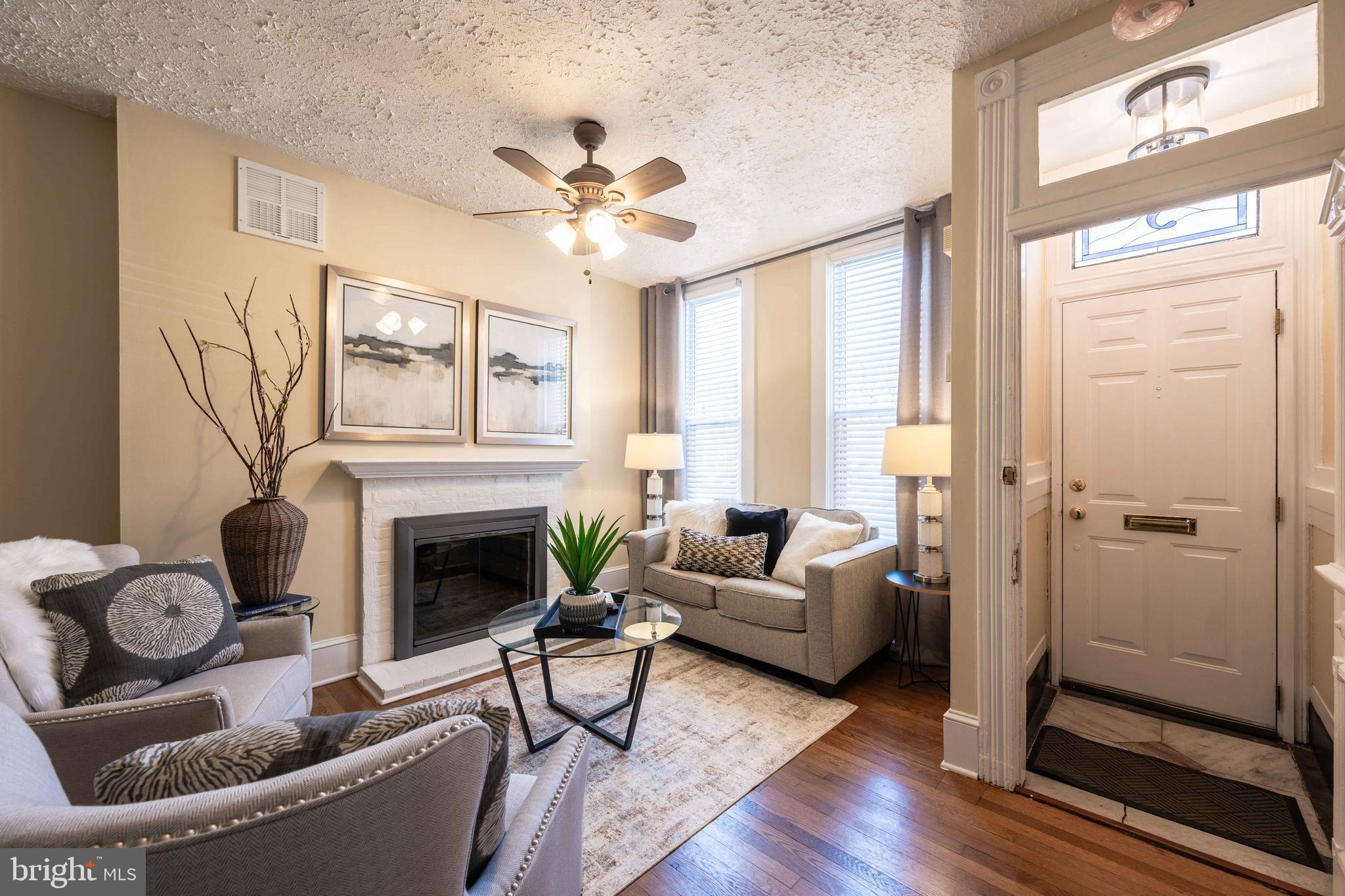 3 East Ostend Street Baltimore, MD 21230 - Photo 6 of 25 a living room with furniture and a fireplace
