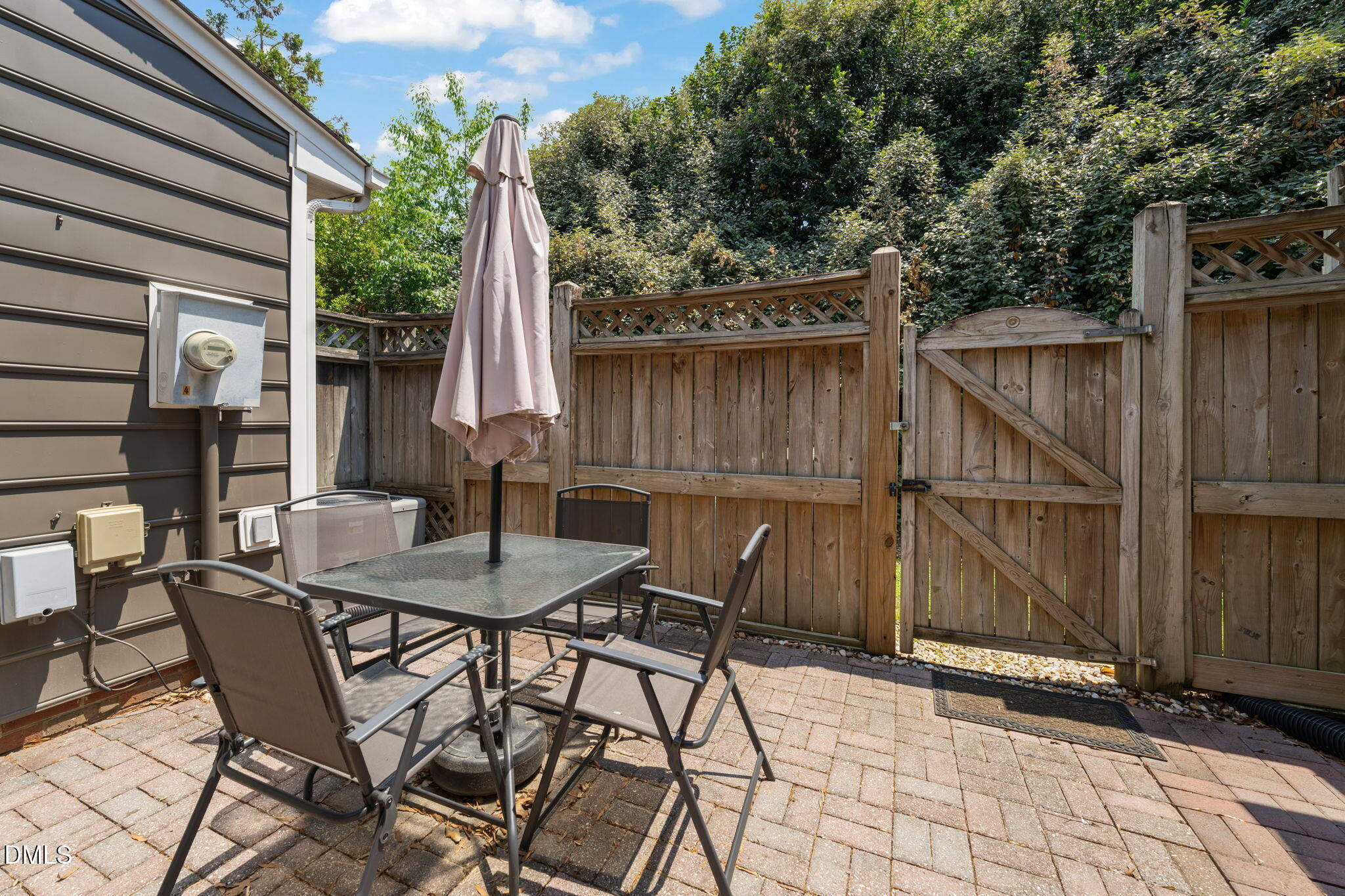 4323 Pine Springs Court Raleigh, NC 27613 - Photo 36 of 38 a view of a patio with a table and chairs and barbeque