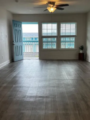 a view of a swimming pool with outdoor seating
