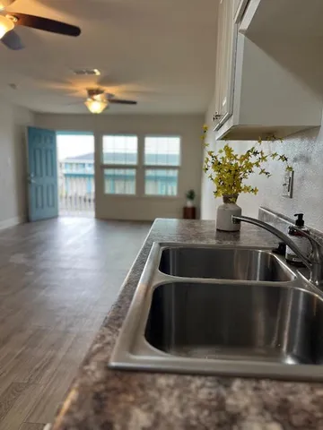 a kitchen with a sink and a window