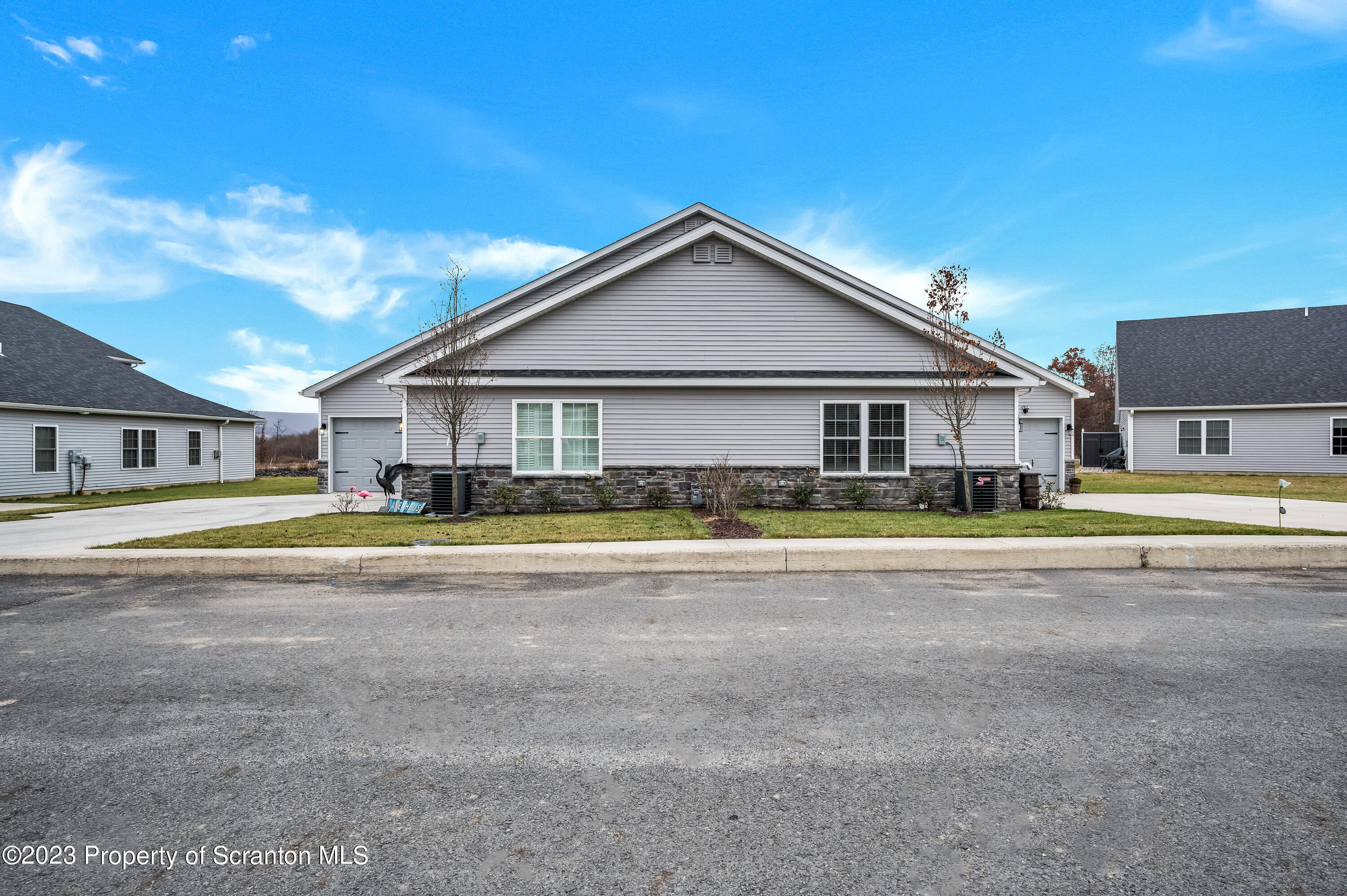 171 Golden Gate Circle Circle Archbald, PA 18403 - Photo 2 of 38 a view of a house with a big yard and large trees
