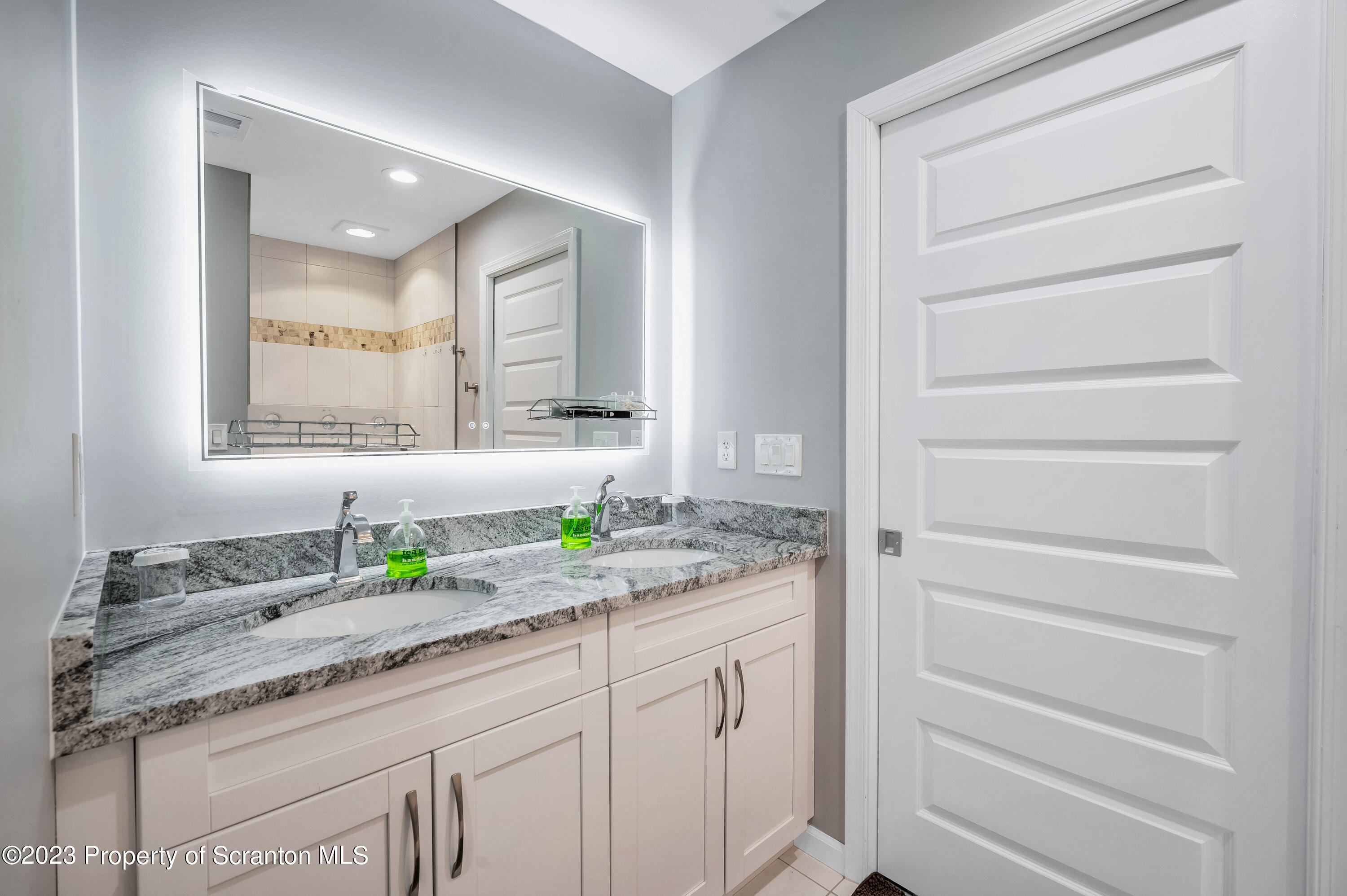 171 Golden Gate Circle Circle Archbald, PA 18403 - Photo 25 of 38 a bathroom with a granite countertop sink and a mirror