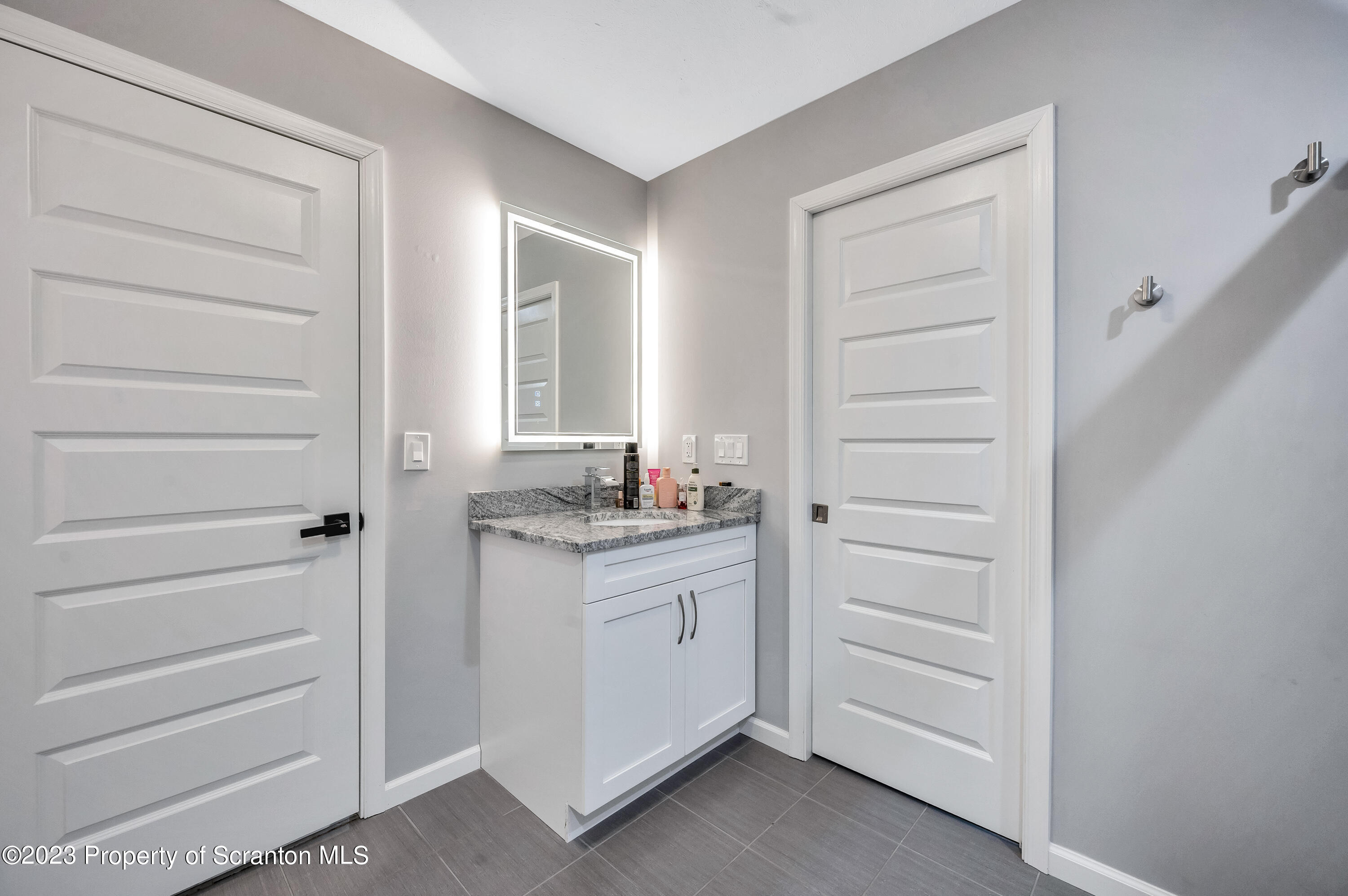 171 Golden Gate Circle Circle Archbald, PA 18403 - Photo 33 of 38 a bathroom with a sink and a mirror