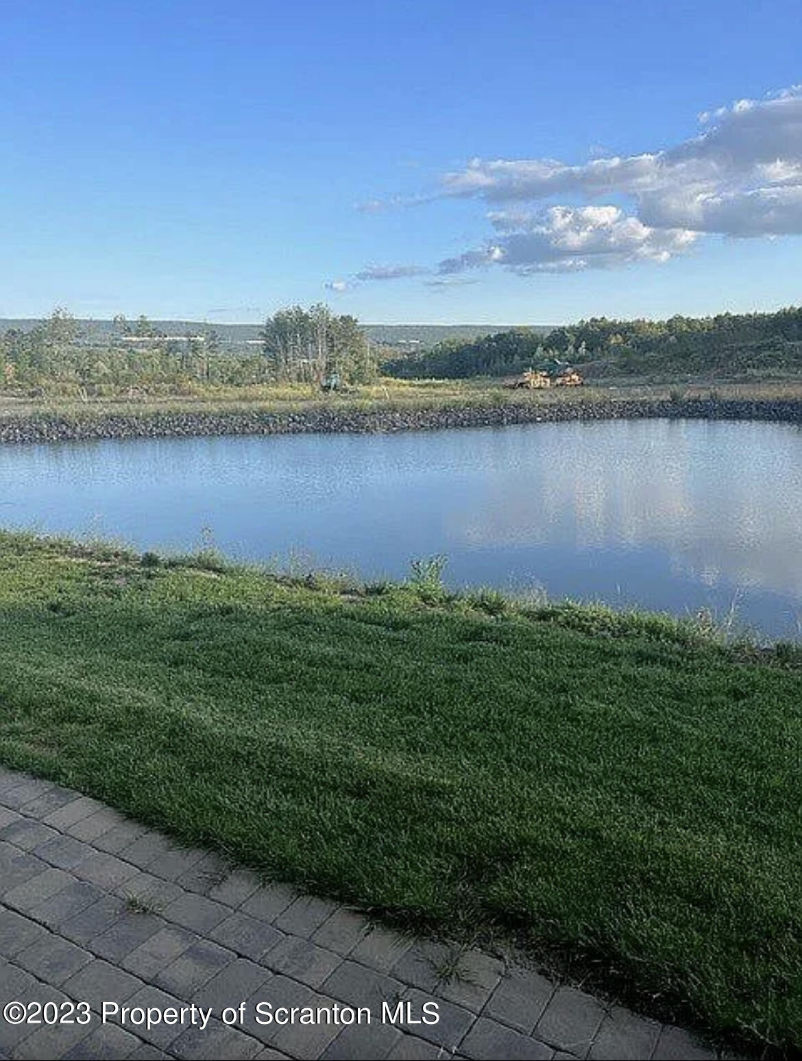 171 Golden Gate Circle Circle Archbald, PA 18403 - Photo 6 of 38 a view of a lake with houses in the back