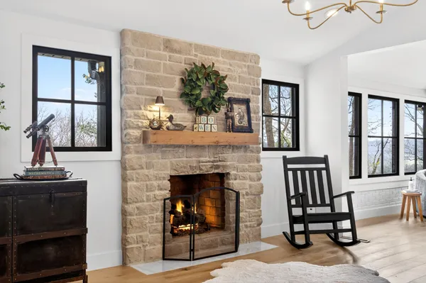 a living room with furniture and a fireplace