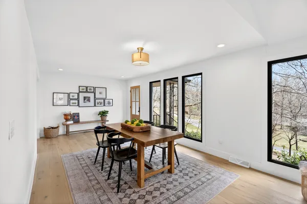 a view of a dining room with furniture and a window