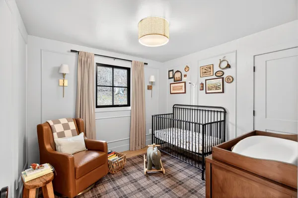 a bedroom with furniture and a window