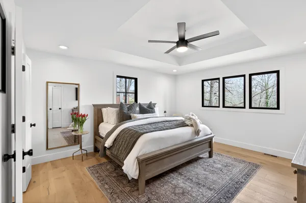 a bed room with a bed and a window