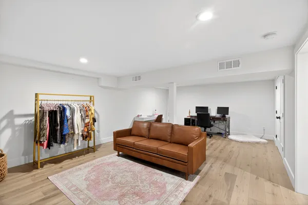 a living room with furniture and a rug