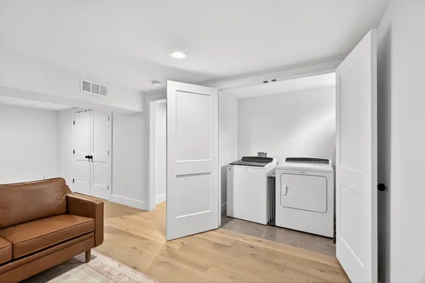 a view of hallway with washer and dryer