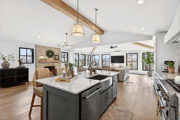 a large kitchen with a table and chairs