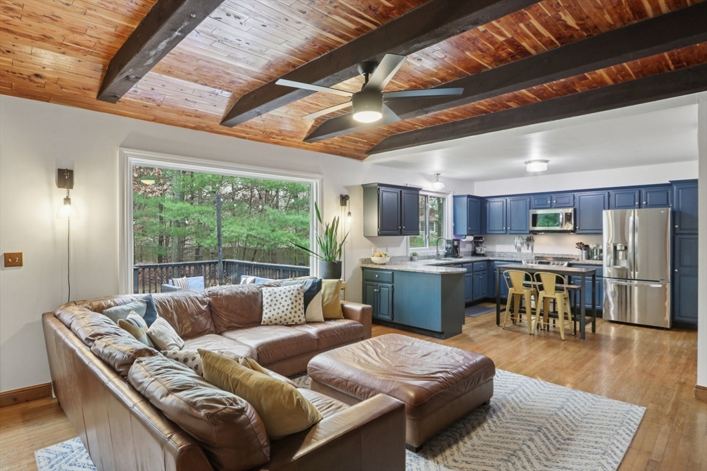19 Roosevelt Road Plymouth, MA 02360 - Photo 15 of 35 a living room with stainless steel appliances granite countertop furniture wooden floor and window