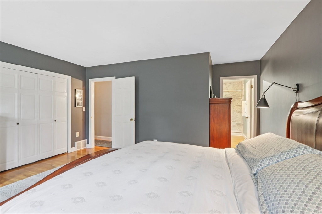 19 Roosevelt Road Plymouth, MA 02360 - Photo 17 of 35 a bedroom with a large bed and a closet