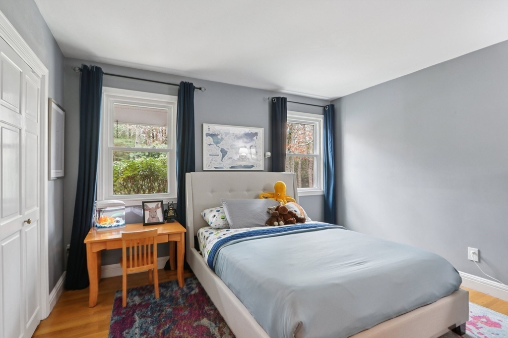 19 Roosevelt Road Plymouth, MA 02360 - Photo 22 of 35 a bed sitting in a bedroom next to a window