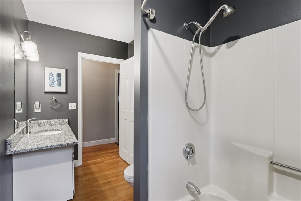 19 Roosevelt Road Plymouth, MA 02360 - Photo 26 of 35 a bathroom with a granite countertop shower sink vanity and mirror