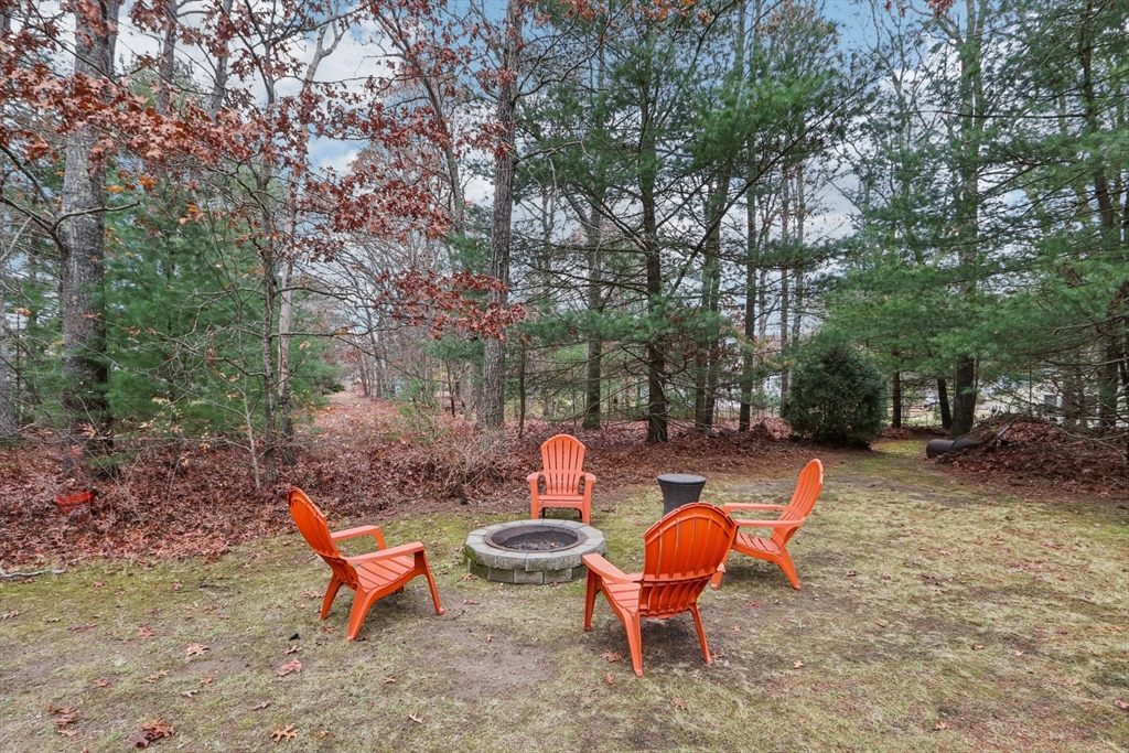 19 Roosevelt Road Plymouth, MA 02360 - Photo 29 of 35 a backyard of a house with table and chairs