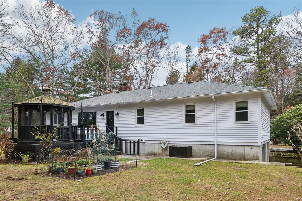 19 Roosevelt Road Plymouth, MA 02360 - Photo 30 of 35 a front view of house with yard and trees in the background