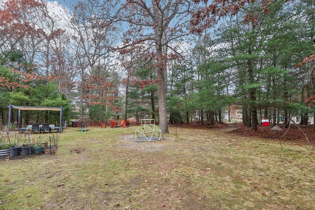 19 Roosevelt Road Plymouth, MA 02360 - Photo 31 of 35 a backyard of a house with table and chairs