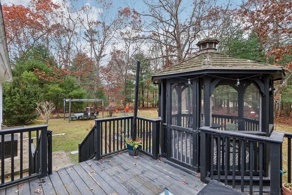 19 Roosevelt Road Plymouth, MA 02360 - Photo 33 of 35 a view of a wooden deck with large trees