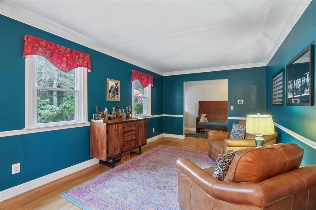 19 Roosevelt Road Plymouth, MA 02360 - Photo 7 of 35 a living room with furniture a window and a flat screen tv