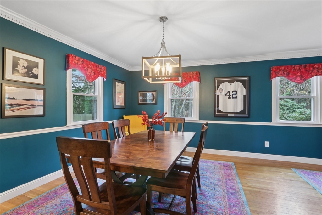 19 Roosevelt Road Plymouth, MA 02360 - Photo 8 of 35 a view of a dining room with furniture window and wooden floor