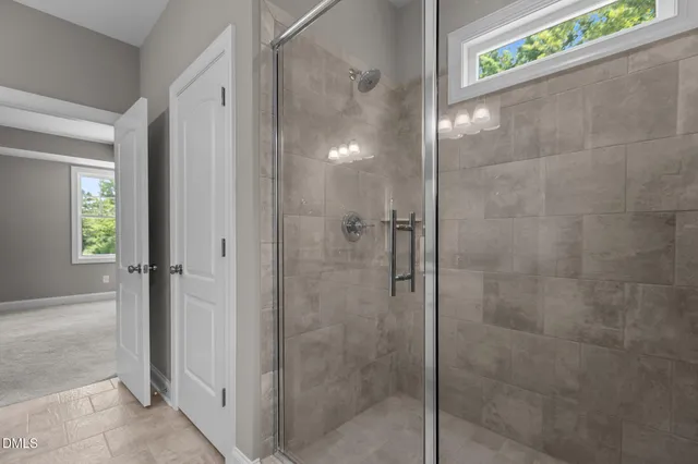 a view of a big house with a big yard and large trees