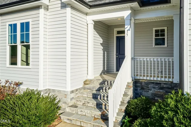 a bed room with a bed and a chandelier