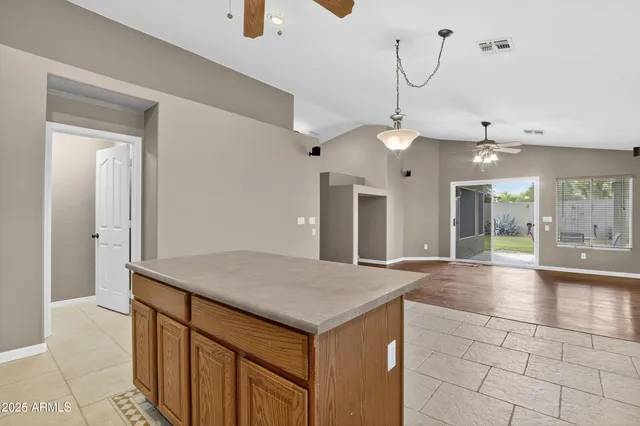 a kitchen with cabinets and stainless steel appliances
