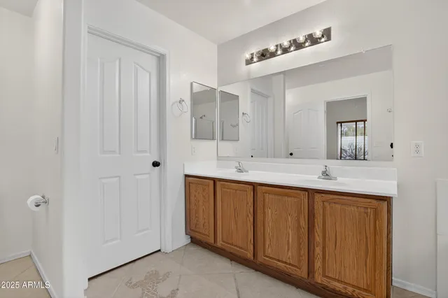 a bathroom with a tub sink and a mirror