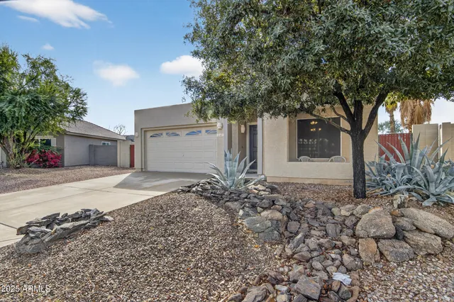 a house with trees in front of it