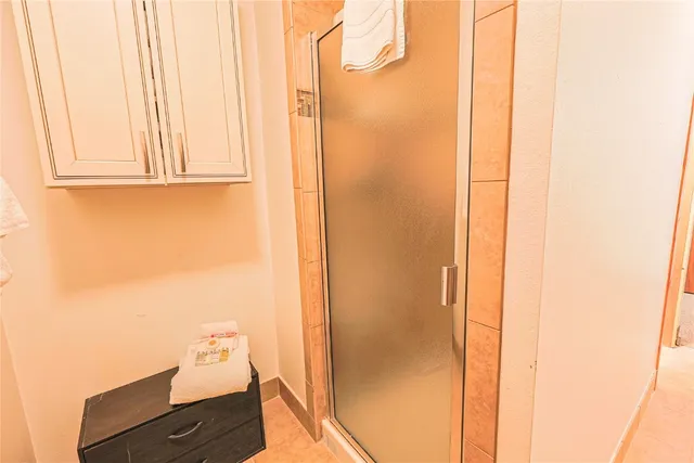 hallway with view of wooden floor