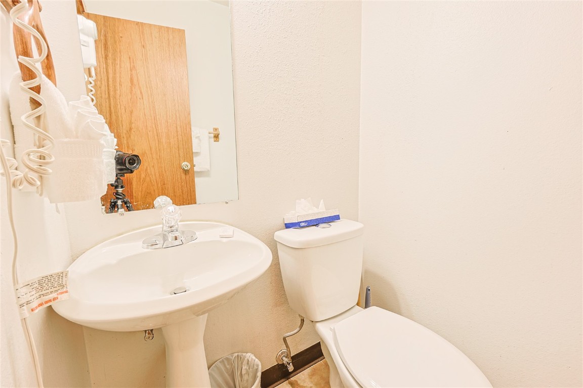 214 Ten Mile Circle, Unit R310 Copper Mountain, CO 80443 - Photo 13 of 15 a white toilet sitting next to a white sink
