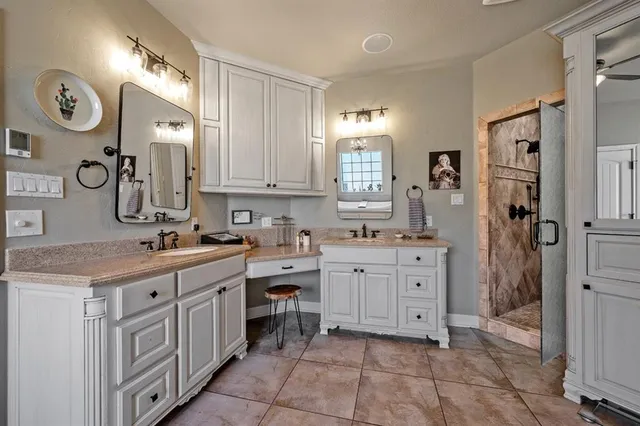 a kitchen with cabinets and window
