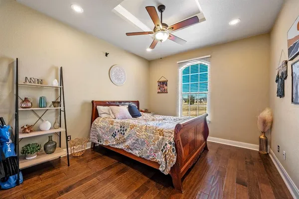a bed sitting in a room next to a window