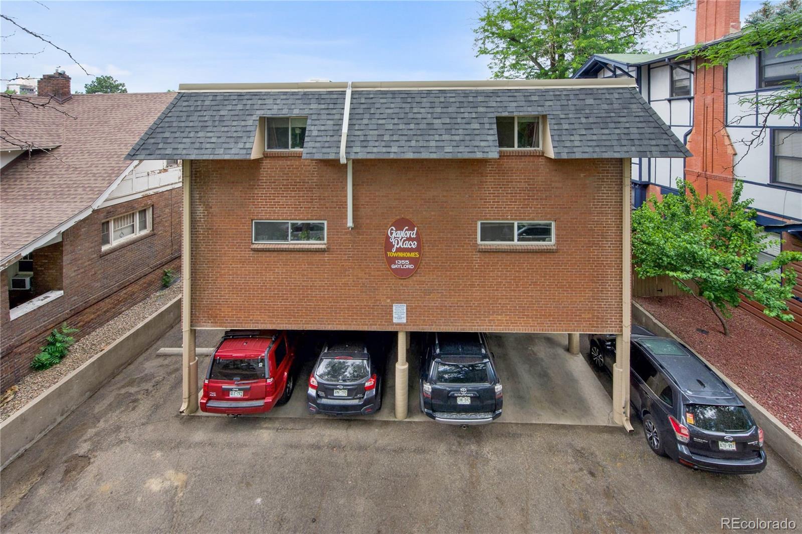 an aerial view of a house with parking space