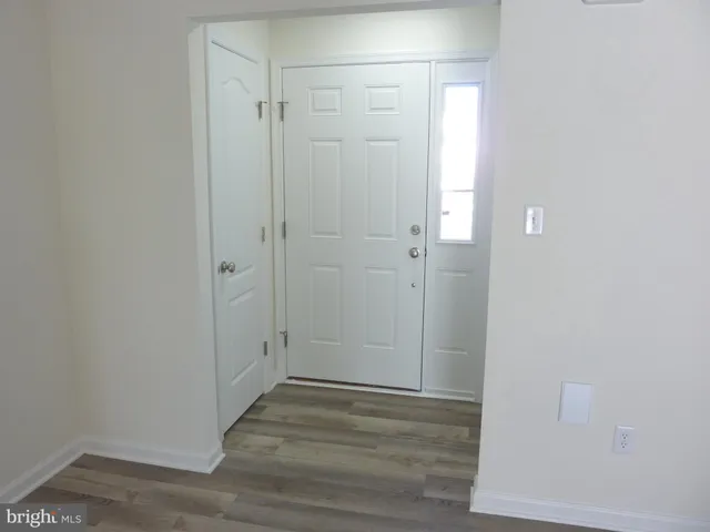 a view of a bathroom with wooden floor