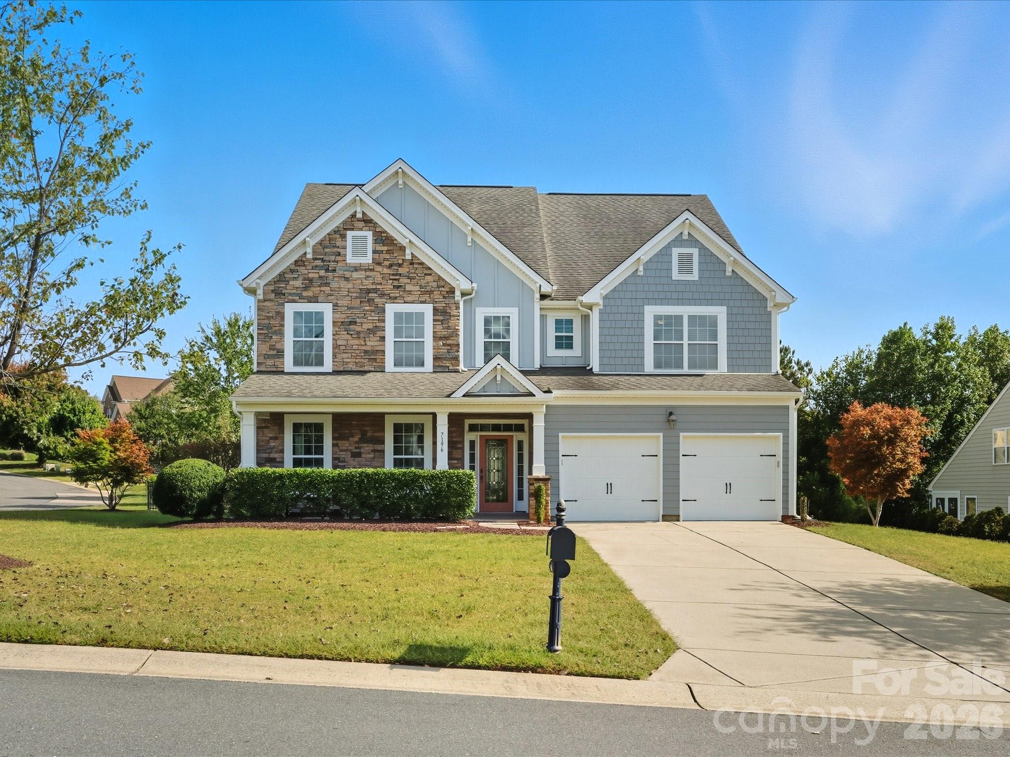 7196 Dove Field Lane Fort Mill, SC 29707 - Photo 1 of 35 a front view of a house with a garden