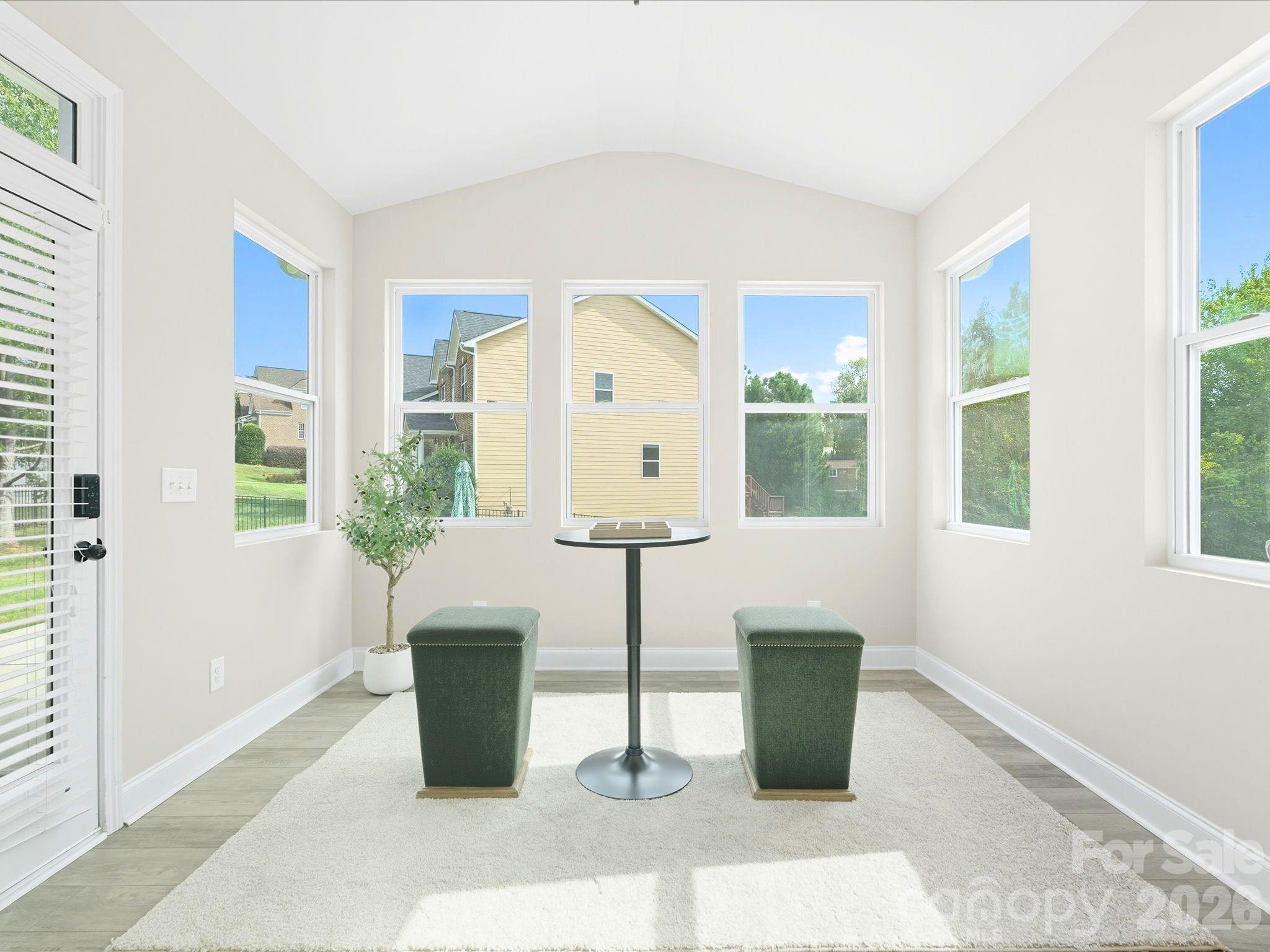 7196 Dove Field Lane Fort Mill, SC 29707 - Photo 13 of 35 a room with a window wooden floor and potted plant