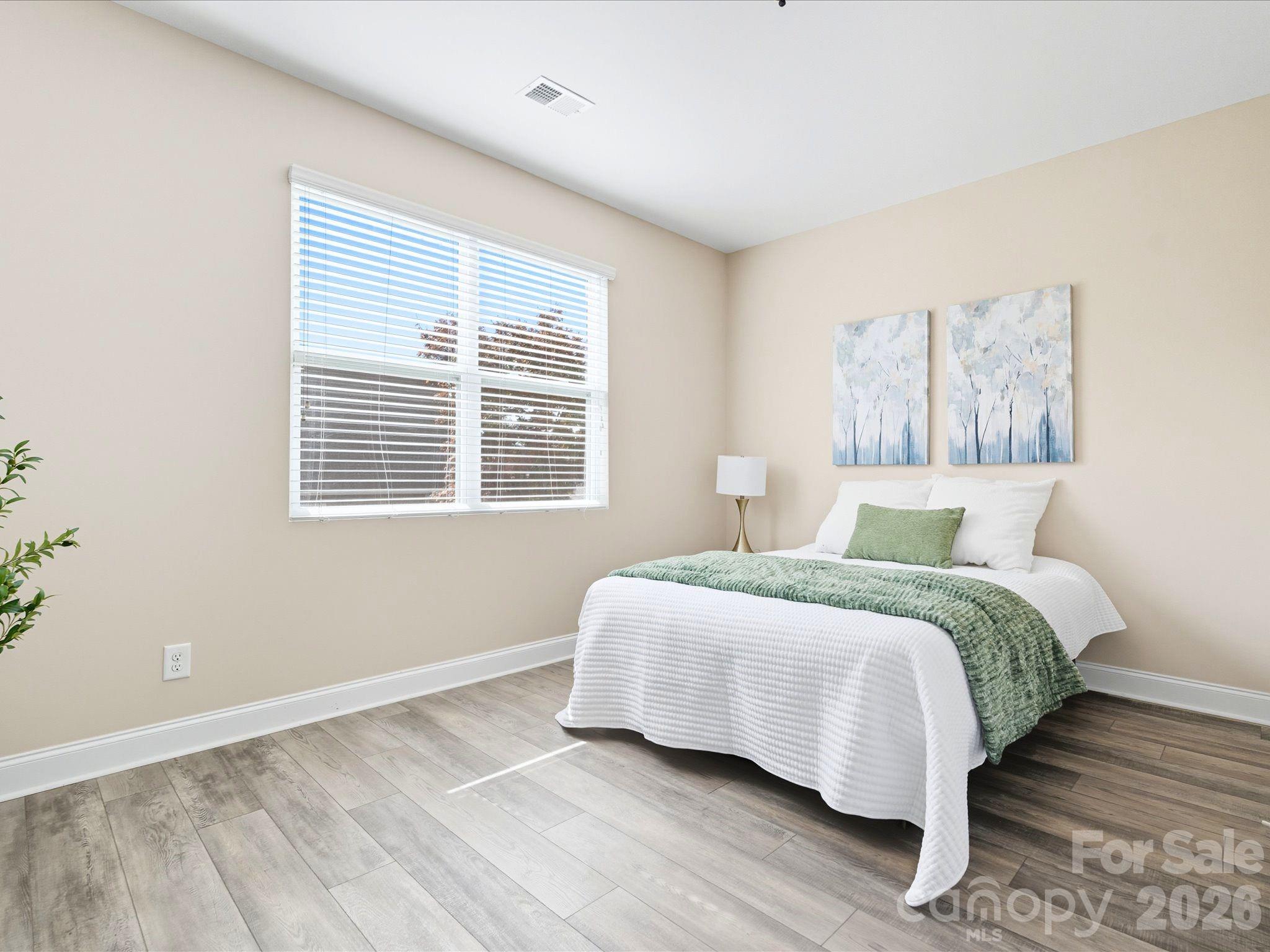 7196 Dove Field Lane Fort Mill, SC 29707 - Photo 16 of 35 a bedroom with a bed and a window