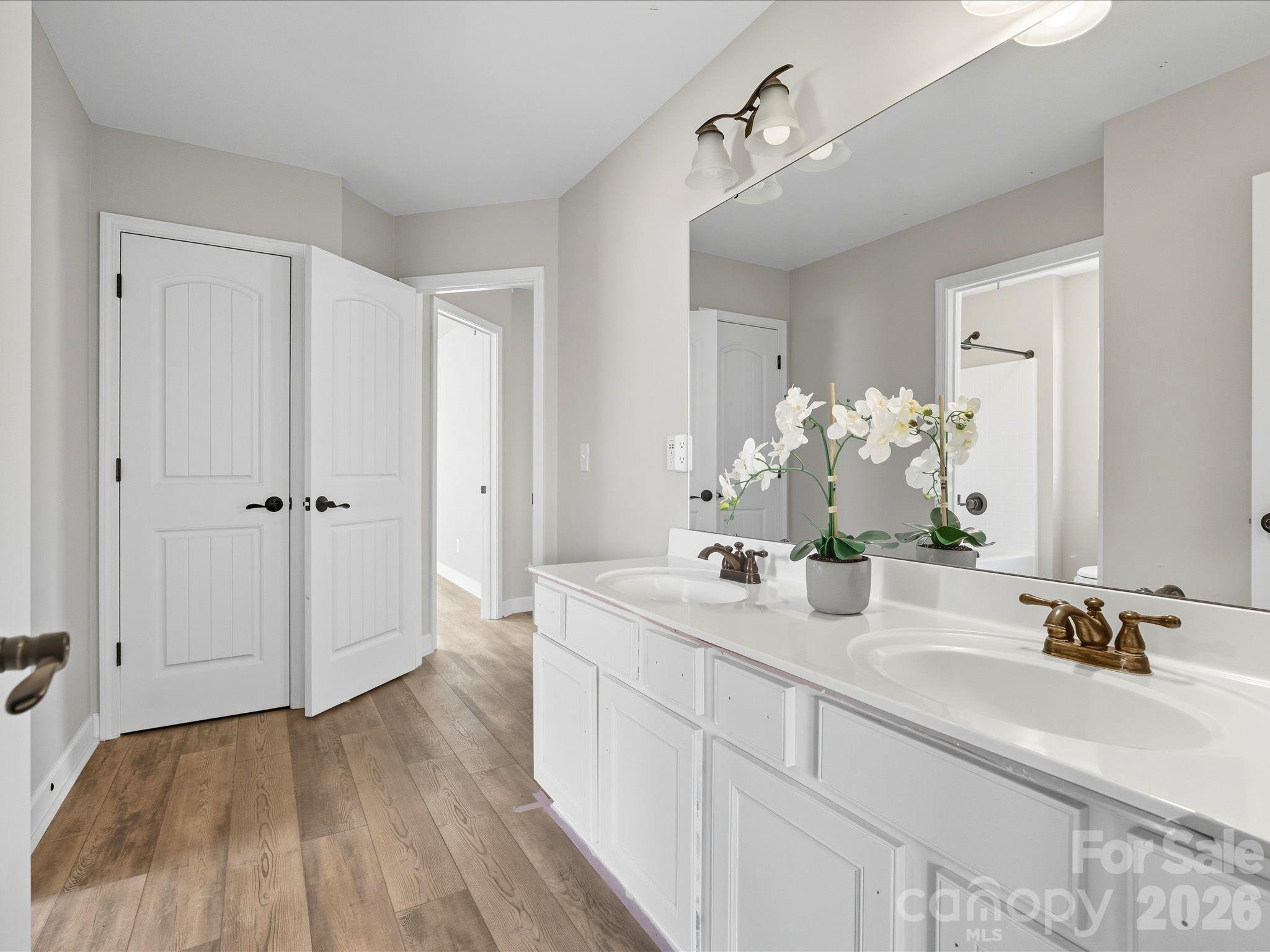 7196 Dove Field Lane Fort Mill, SC 29707 - Photo 24 of 35 a bathroom with a sink and mirror