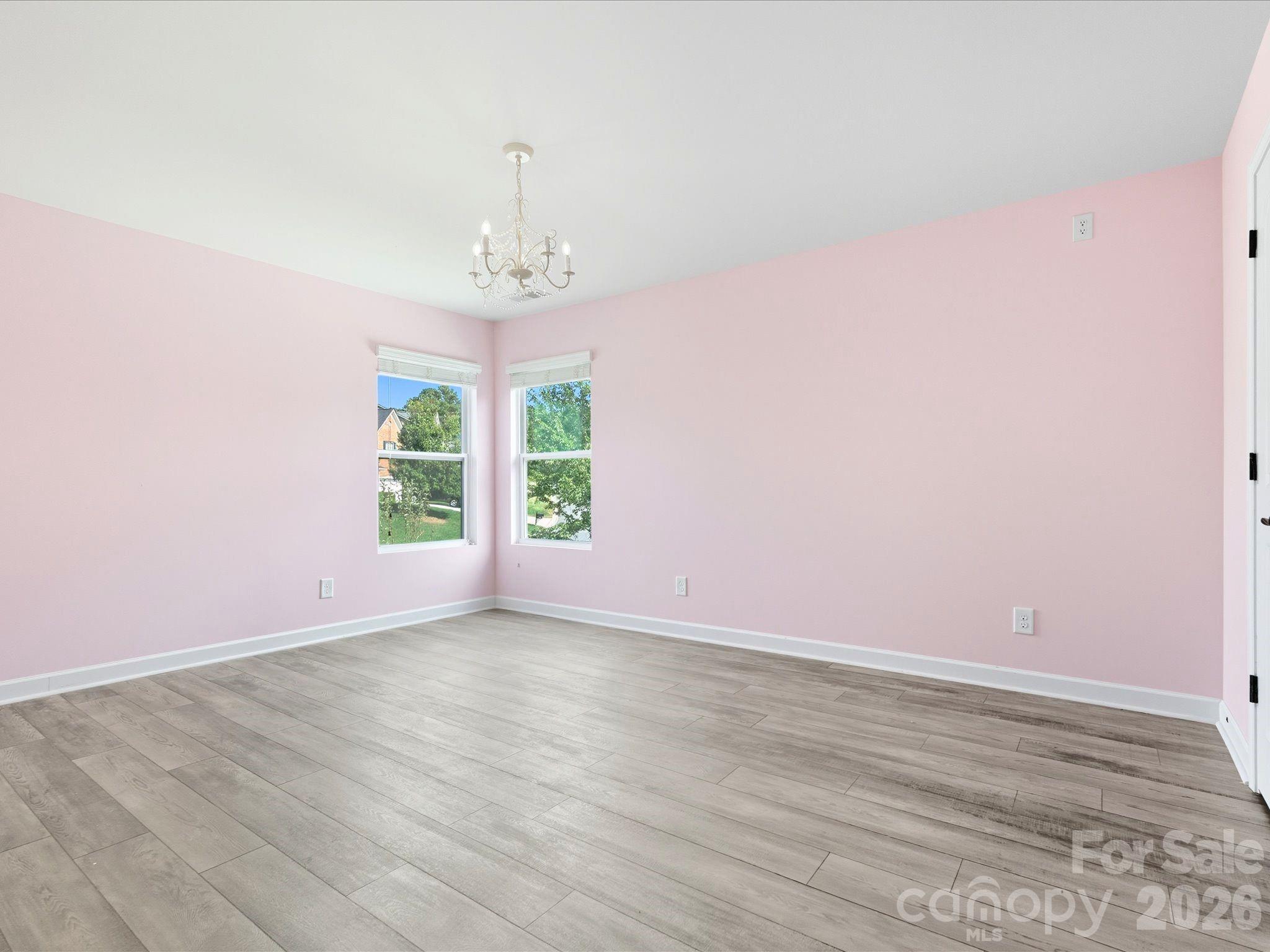 7196 Dove Field Lane Fort Mill, SC 29707 - Photo 25 of 35 an empty room with wooden floor and windows