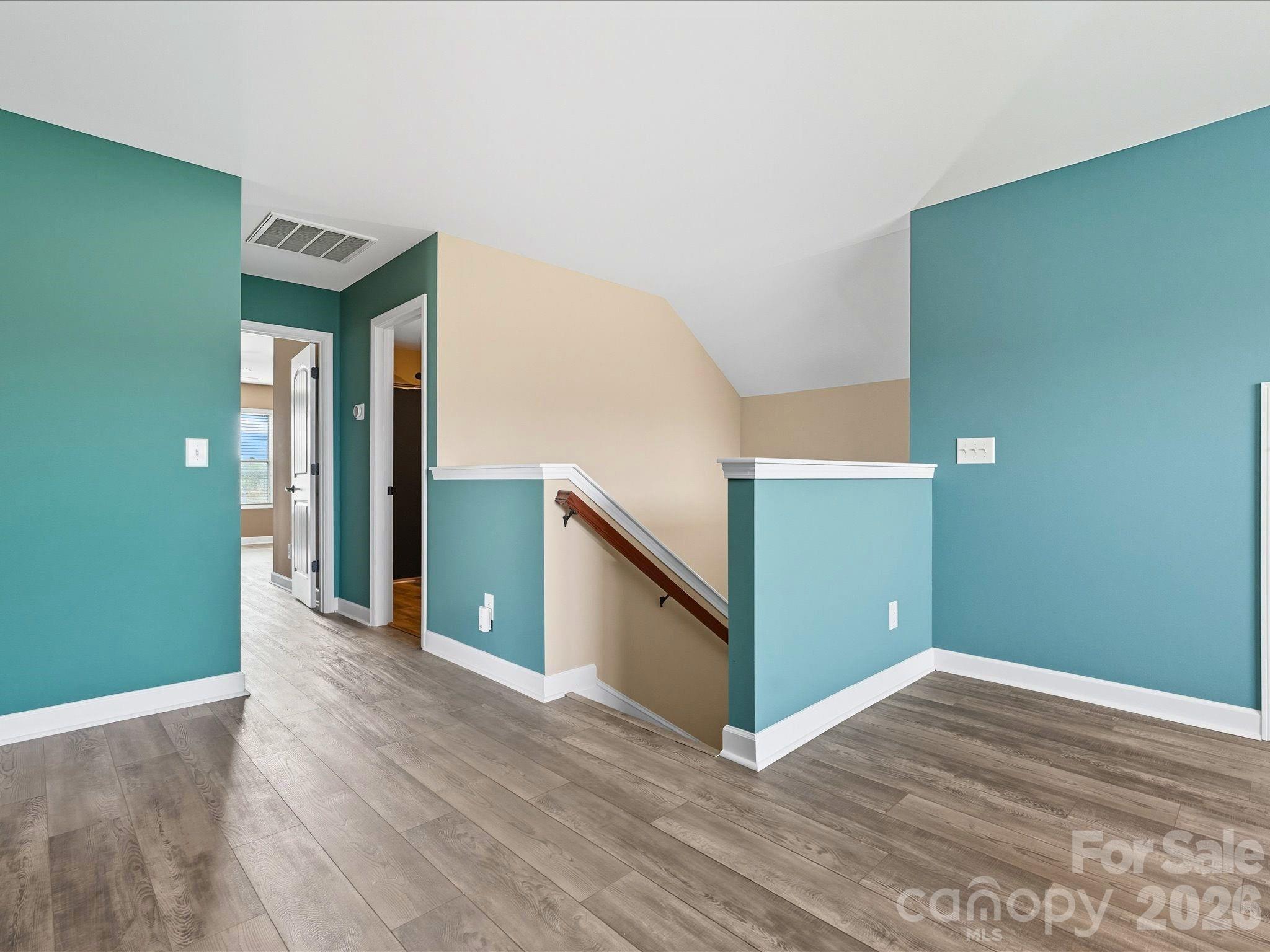 7196 Dove Field Lane Fort Mill, SC 29707 - Photo 27 of 35 a view of a hallway with wooden floor